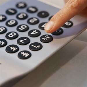 Finger Pressing Button on Calculator
